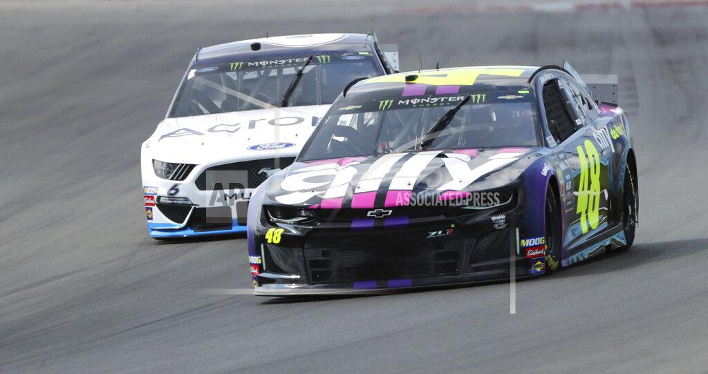 Jimmie Johnson (48) heads into Turn 1 during a practice for the NASCAR Cup Series auto race at Watkins Glen International, Saturday, Aug. 3, 2019, in Watkins Glen, N.Y. (AP Photo/John Munson)
