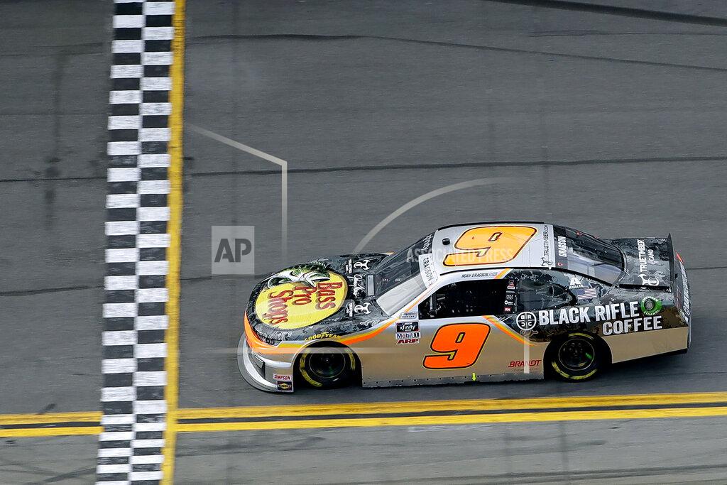 Chris O'meara Noah Gragson (9) prepares to cross the finish line to win the NASCAR Xfinity series auto race Saturday, Feb. 15, 2020, at Daytona International Speedway in Daytona Beach, Fla. (AP Photo/Chris O'Meara)