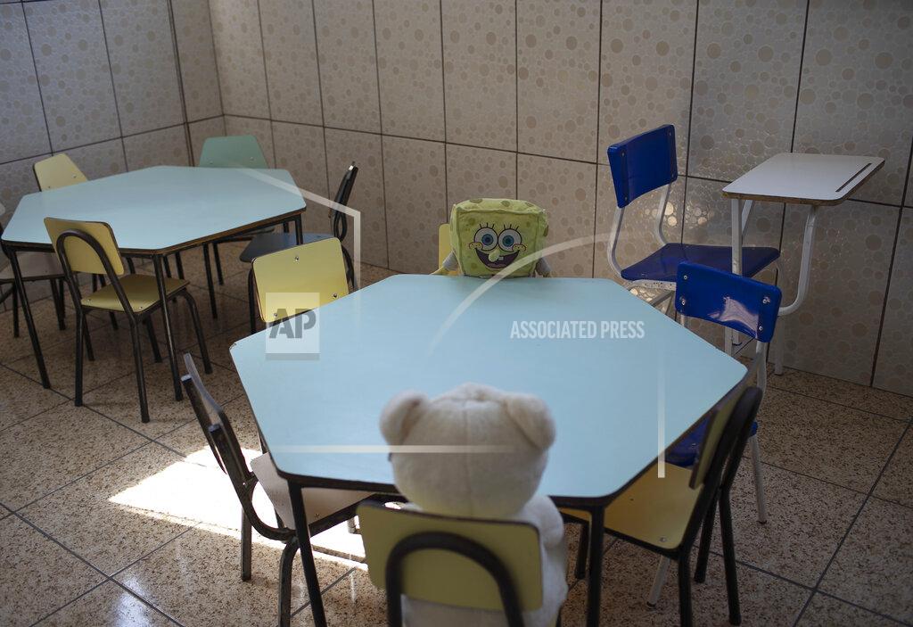 Silvia Izquierdo Stuffed animal toys are used to remind children to keep there distance amid the COVID-19 pandemic, at the Pereira Agustinho daycare, nursery school and pre-school, after it reopened amid the new coronavirus pandemic in Duque de Caxias, Monday, July 6, 2020. The city of Manaus in the Amazon rainforest and Duque de Caxias in Rio de Janeiro’s metropolitan region, became on Monday the first Brazilian cities to resume in-person classes at private schools since the onset of the COVID-19 pandemic, according to the nation's private school federation. (AP Photo/Silvia Izquierdo)