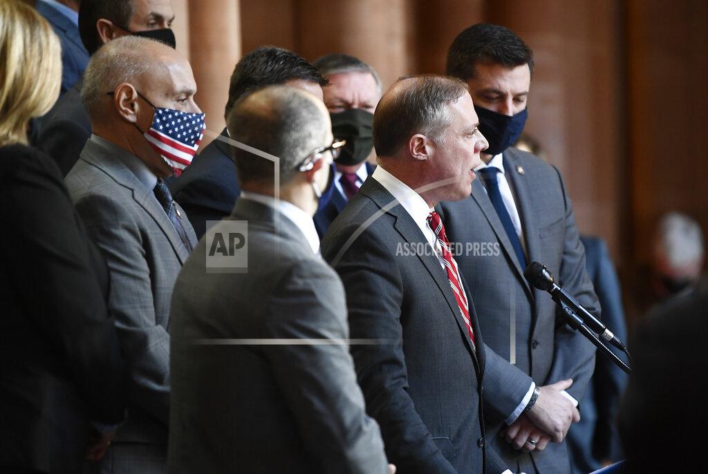 Hans Pennink Assemblyman Minority Leader William A. Barclay, R- Fulton, second from right, stands with Assembly Republicans calling for the impeachment of New York Gov. Andrew Cuomo during a news conference at the state Capitol, Monday, March 8, 2021, in Albany, N.Y. (AP Photo/Hans Pennink)