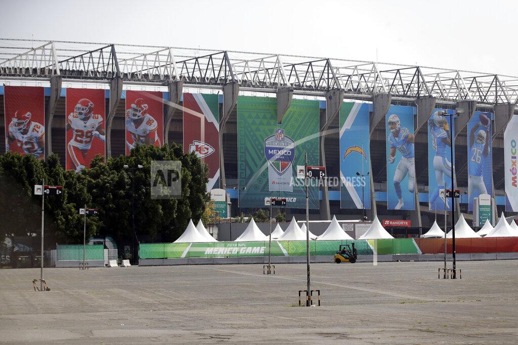 Marcio Jose Sanchez Banners showing players from the Los Angeles Chargers and the Kansas City Chiefs hang from Aztec Stadium, days before an NFL football game, Saturday, Nov. 16, 2019, in Mexico City. The Chargers face the Chiefs on Monday, Nov. 18. (AP Photo/Marcio Jose Sanchez)