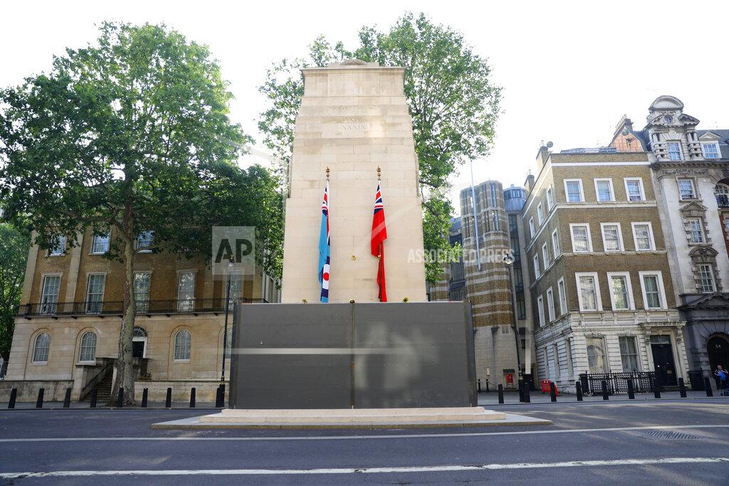 Aaron Chown A protective shield installed overnight surrounds the statue of the Cenotaph in Whitehall, London, Friday, June 12, 2020, following Black Lives Matter protests that took place across the UK over the weekend. The protests were ignited by the death of George Floyd, who died after he was restrained by Minneapolis police on May 25. (Aaron Chown/PA via AP)