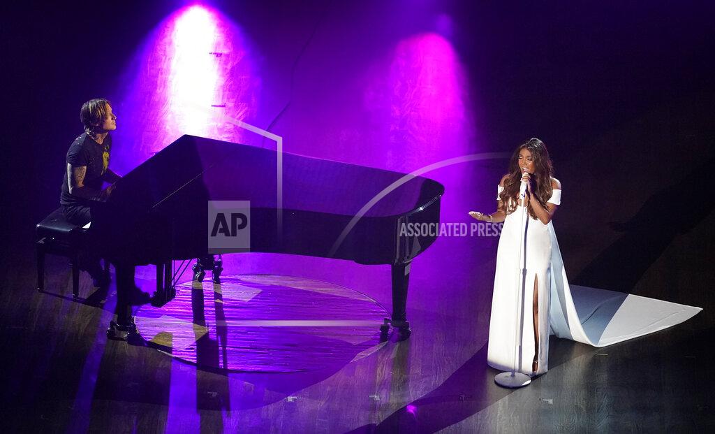 Mark Humphrey Mickey Guyton, right, and Keith Urban perform "What Are You Gonna Tell Her?" during the 55th annual Academy of Country Music Awards at the Grand Ole Opry House on Wednesday, Sept. 16, 2020, in Nashville, Tenn. (AP Photo/Mark Humphrey)
