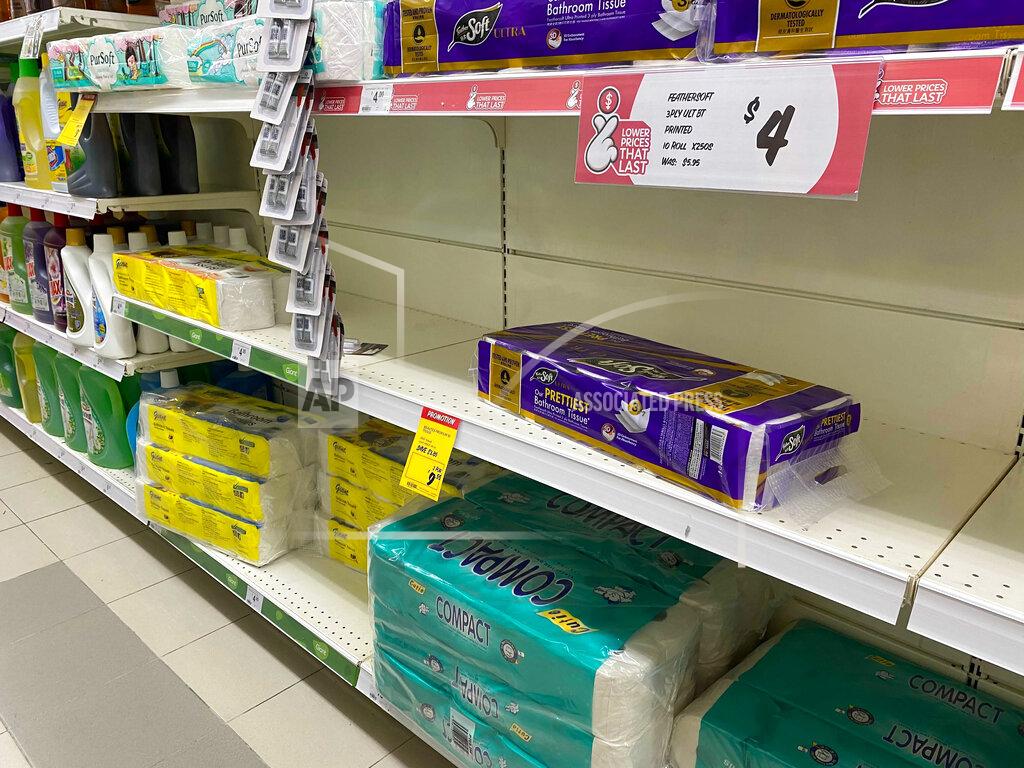 Zen Soo Shelves with reduced stocks of toilet paper are seen at a supermarket in Singapore, Friday, May 14, 2021. Singapore further tightened its COVID-19 measures as it sought to control an increase in untraceable coronavirus infections in the city-state. (AP Photo/Zen Soo)