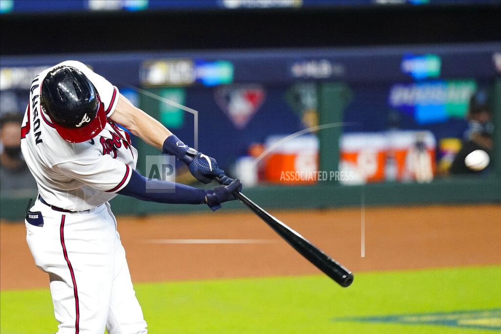 Eric Gay Atlanta Braves' Dansby Swanson hits a home run during the second inning in Game 2 of a baseball National League Division Series against the Miami Marlins Wednesday, Oct. 7, 2020, in Houston. (AP Photo/Eric Gay)