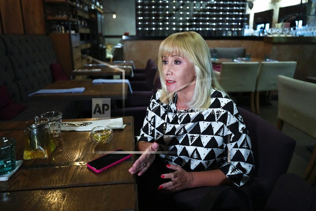 Pavel Golovkin Lawmaker Oksana Pushkina speaks during an interview with The Associated Press in Moscow, Russia, Tuesday, Sept. 14, 2021. Pushkina, who in recent years has been a firebrand in pushing for domestic violence legislation, is not seeking reelection after her party, United Russia, endorsed another candidate in her constituency. (AP Photo/Pavel Golovkin)