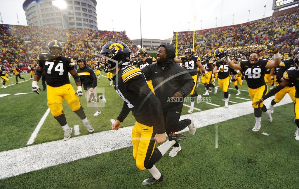 Charlie Neibergall Iowa placekicker Miguel Recinos, center, celebrates with teammates after making a 41-yard field goal on the final play of an NCAA college football game against Nebraska, Friday, Nov. 23, 2018, in Iowa City, Iowa. (AP Photo/Charlie Neibergall)