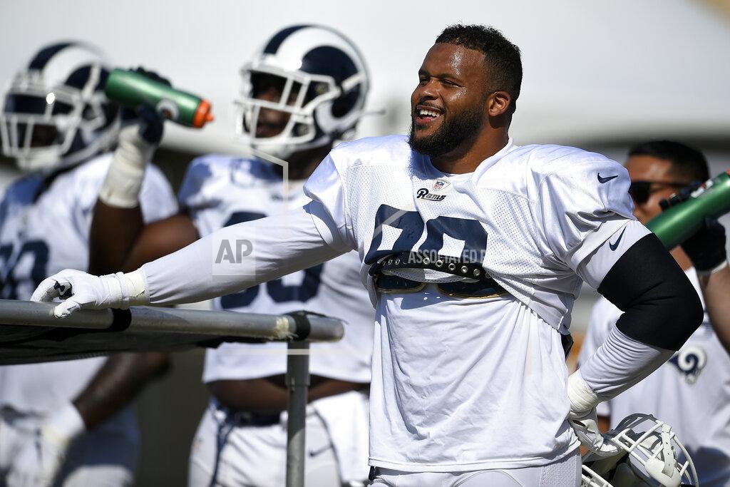 Kelvin Kuo FILE - In this July 30, 2019, file photo, Los Angeles Rams defensive end Aaron Donald is shown during an NFL football training camp, in Irvine, Calif. Todd Gurley, Aaron Donald and now Jared Goff have all agreed to contract extensions over the past year that set new NFL benchmarks for guaranteed money at their respective positions. (AP Photo/Kelvin Kuo, File)