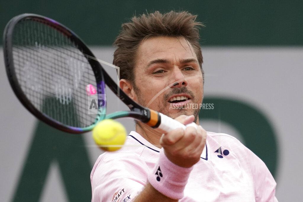 Christophe Ena Switzerland's Stan Wawrinka plays a shot against France's Corentin Moutet during their first round match at the French Open tennis tournament in Roland Garros stadium in Paris, France, Monday, May 23, 2022. (AP Photo/Christophe Ena)