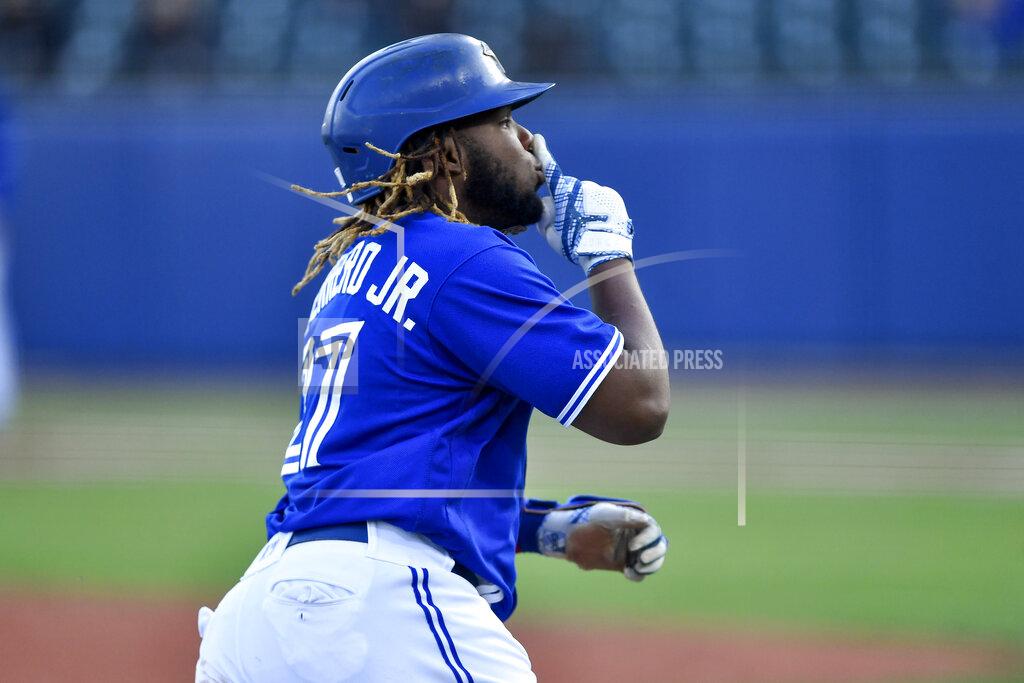 Adrian Kraus Toronto Blue Jays' Vladimir Guerrero Jr. gestures as he rounds the bases after hitting a three-run home run against the Miami Marlins during the third inning of a baseball game in Buffalo, N.Y., Tuesday, June 1, 2021. (AP Photo/Adrian Kraus)