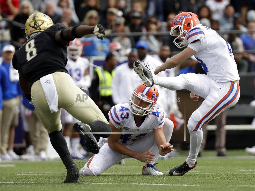 Mark Humphrey Florida place kicker Evan McPherson, right, kicks a 43-yard field goal as Vanderbilt cornerback Joejuan Williams (8) rushes in the second half of an NCAA college football game Saturday, Oct. 13, 2018, in Nashville, Tenn. Holding is Tommy Townsend (43). Florida won 37-27. (AP Photo/Mark Humphrey)