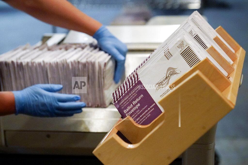 FILE - In this Nov. 1, 2020, file photo, envelopes containing ballots are shown at a San Francisco Department of Elections at a voting center in San Francisco. A new study finds the expansion of mail voting did not benefit Democrats or increase turnout. (AP Photo/Jeff Chiu, File)