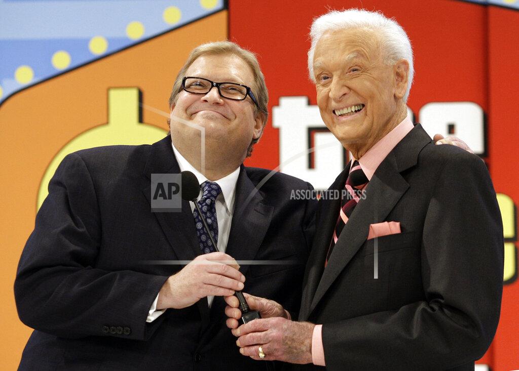 Damian Dovarganes FILE - The Price is Right show host, comedian Drew Carey, left, appears with longtime former host Bob Barker at the CBS Studio Center in Los Angeles on March 25, 2009. Barker, who retired and passed the microphone off to Carey, appeared on the show to promote his autobiography, "Priceless Memories." The longest-running game show in television history is celebrating it’s 50th season. (AP Photo/Damian Dovarganes, File