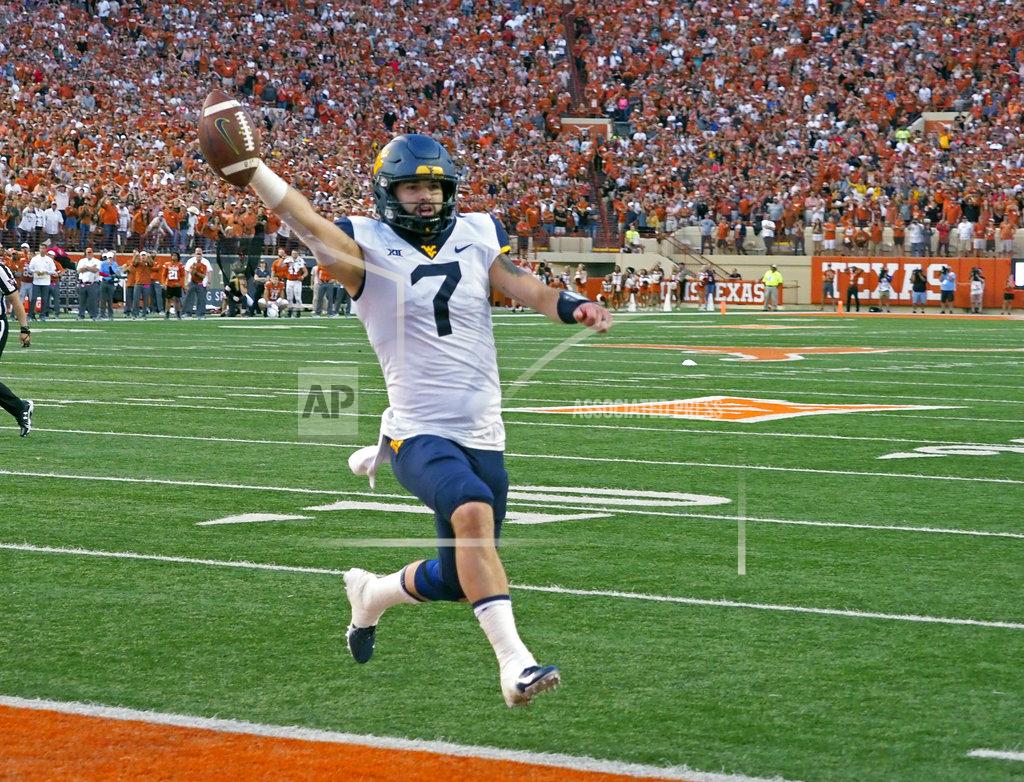 Michael Thomas West Virginia quarterback Will Grier runs in the game winning two-point conversion with 16 second to go in an NCAA college football game against Texas, Saturday, Nov. 3, 2018, in Austin, Texas. West Virginia won 42-41. (AP Photo/Michael Thomas)