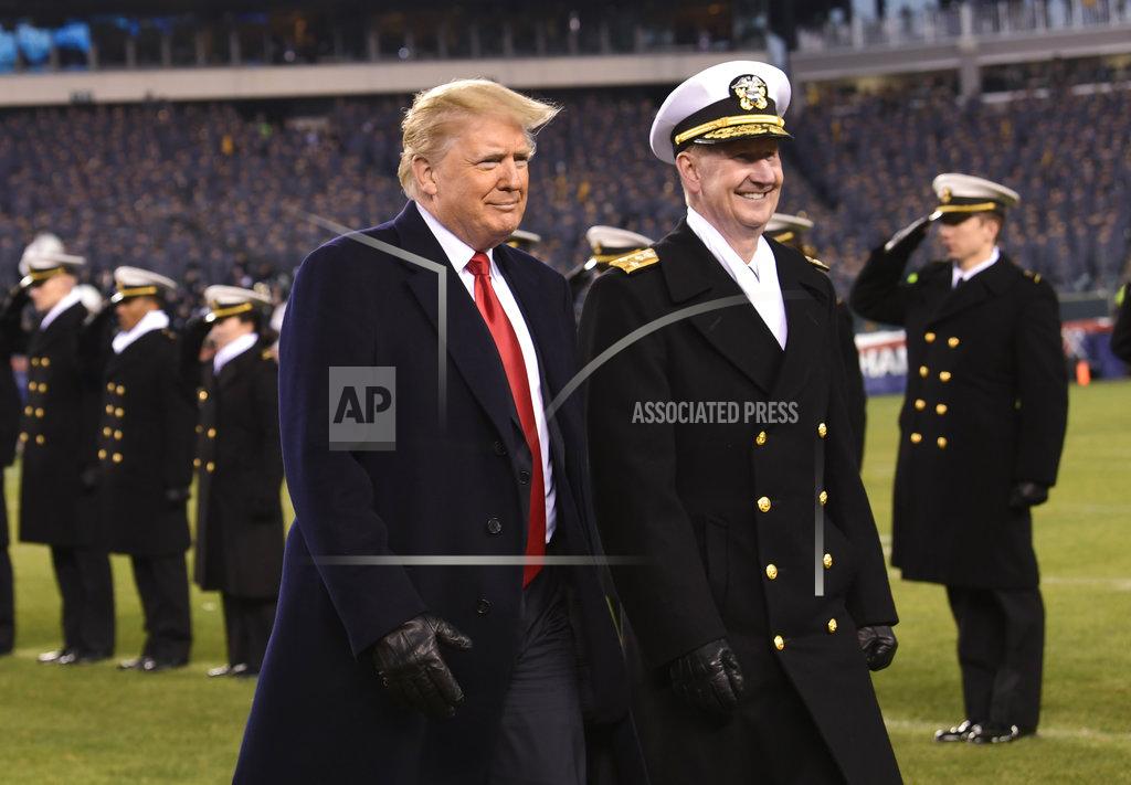 Susan Walsh President Donald Trump, center, walks with Naval Academy Superintendent Vice Adm. Ted Carter, right, across the field during half-time at the Army-Navy football game in Philadelphia, Saturday, Dec. 8, 2018. (AP Photo/Susan Walsh)