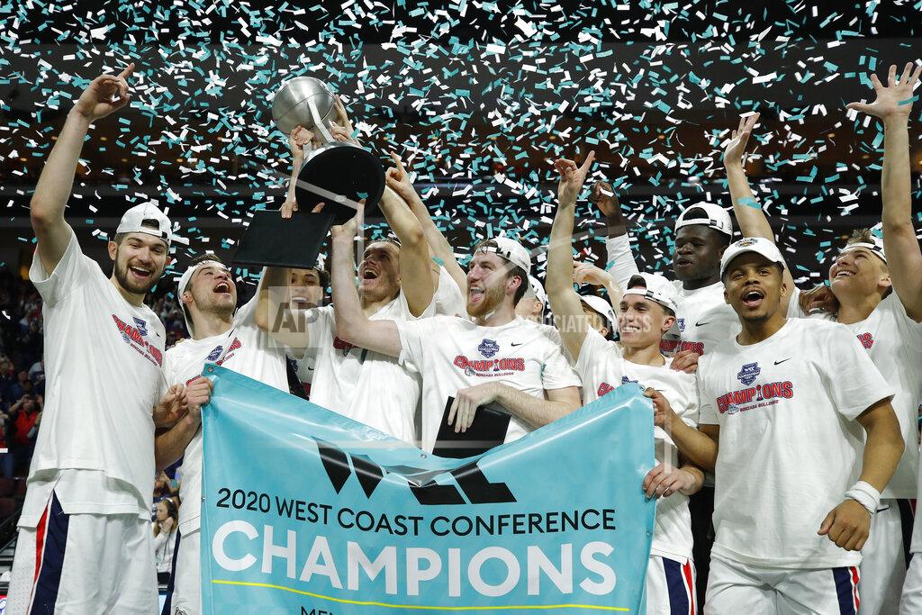 John Locher FILE - In this March 10, 2020, file photo, Gonzaga players celebrate after defeating Saint Mary's in an NCAA college basketball game in the final of the West Coast Conference men's tournament in Las Vegas. The WCC Presidents' Council will delay the beginning of fall competition in all Conference sports due to the COVID-19 pandemic. WCC programs will not participate in any competition prior to Sept. 24, 2020. This decision includes the traditional fall seasons in men's and women's cross country, men's and women's soccer and women's volleyball. Baseball, beach volleyball, men's and women's golf, women's rowing, softball and men's and women's tennis, which hold their traditional seasons in the spring, will not participate in a fall competition scheduled prior to Sept. 24. (AP Photo/John Locher, File)