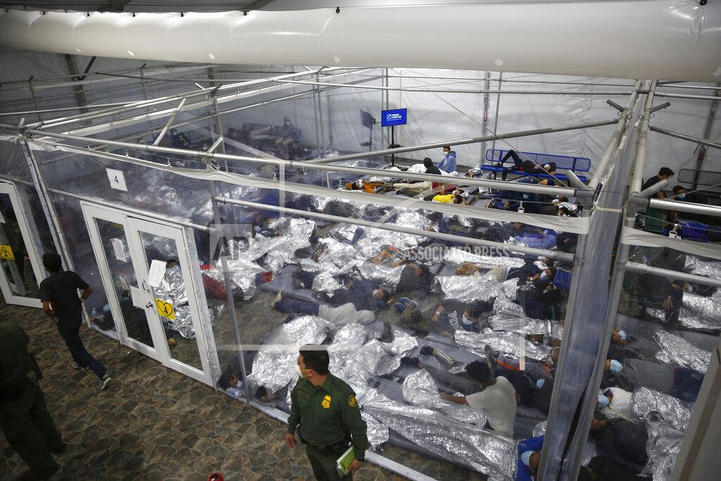 Dario Lopez-Mills FILE - In this March 30, 2021, file photo, young minors lie inside a pod at the Donna Department of Homeland Security holding facility, the main detention center for unaccompanied children in the Rio Grande Valley run by U.S. Customs and Border Protection (CBP), in Donna, Texas. U.S. authorities say they picked up nearly 19,000 children traveling alone across the Mexican border in March. It's the largest monthly number ever recorded and a major test for President Joe Biden as he reverses many of his predecessor's hardline immigration tactics. (AP Photo/Dario Lopez-Mills, Pool, File)