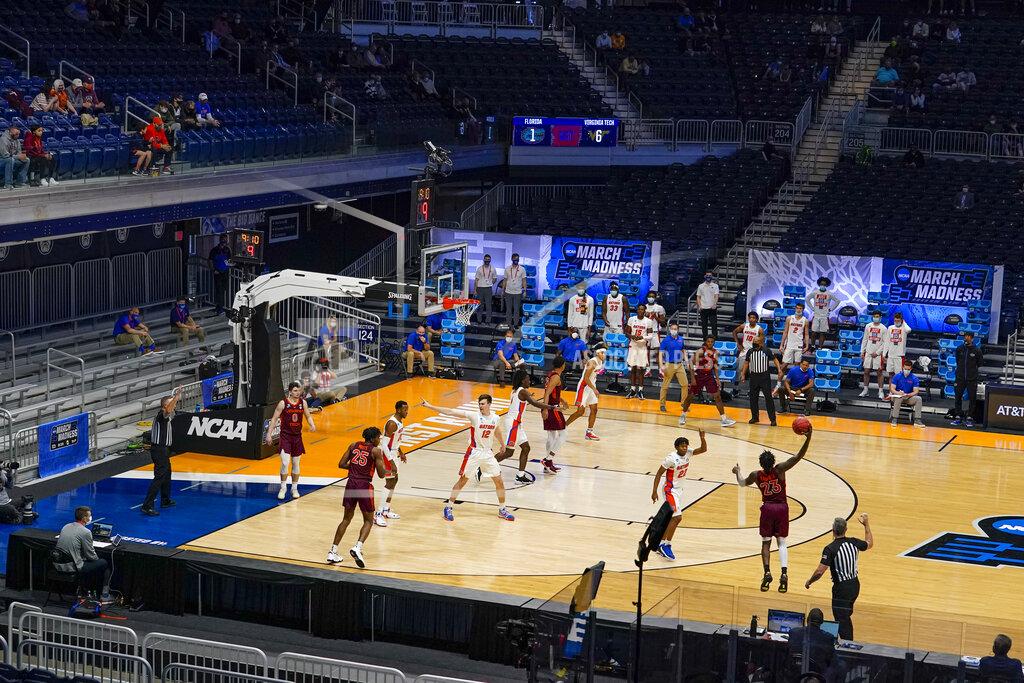 Michael Conroy Florida plays against Virginia Tech in the first half of a first round game in the NCAA men's college basketball tournament at Hinkle Fieldhouse in Indianapolis, Friday, March 19, 2021. Restrictions due to the COVID-19 pandemic have limited crowds, reduced interactions and created an abnormal NCAA experience for those involved. (AP Photo/Michael Conroy)