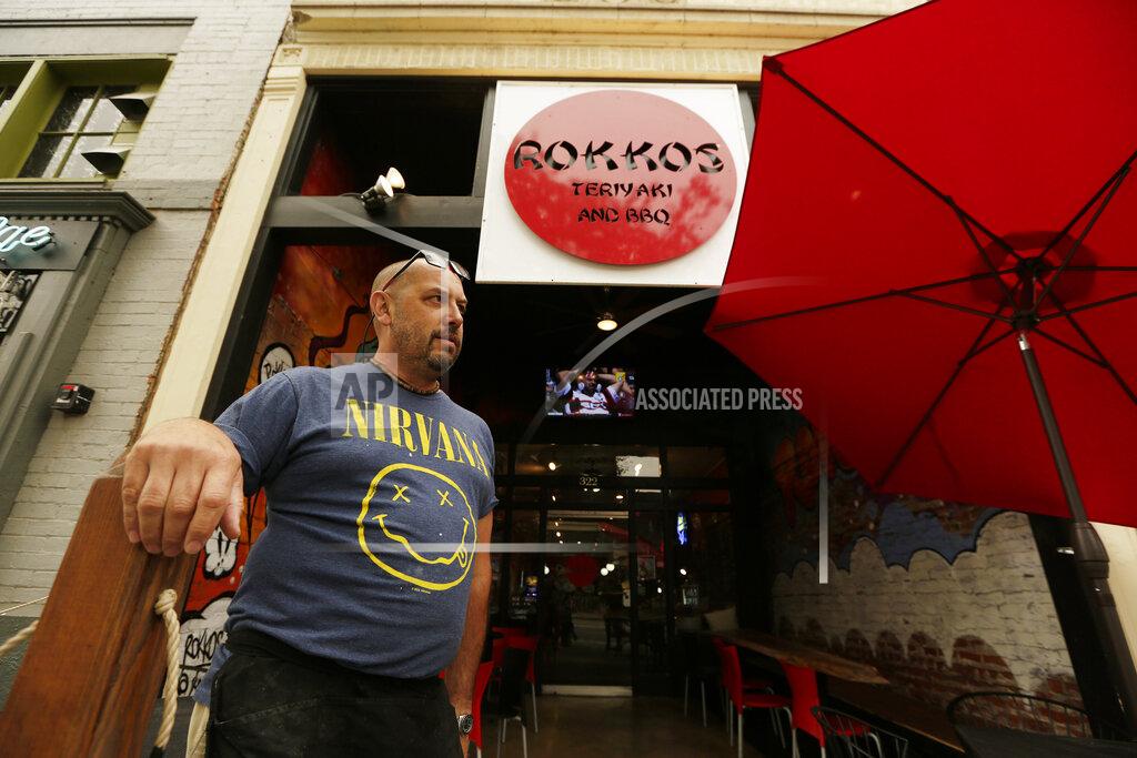 Young Kwak David Hall, co-owner at Rokkos Teriyaki and BBQ, speaks about the effects on business due to coronavirus, Friday, Sept. 10, 2021, in Coeur d'Alene, Idaho. Northern Idaho has a long and deep streak of antigovernment activism that is confounding attempts to battle a COVID-19 outbreak.(AP Photo/Young Kwak)