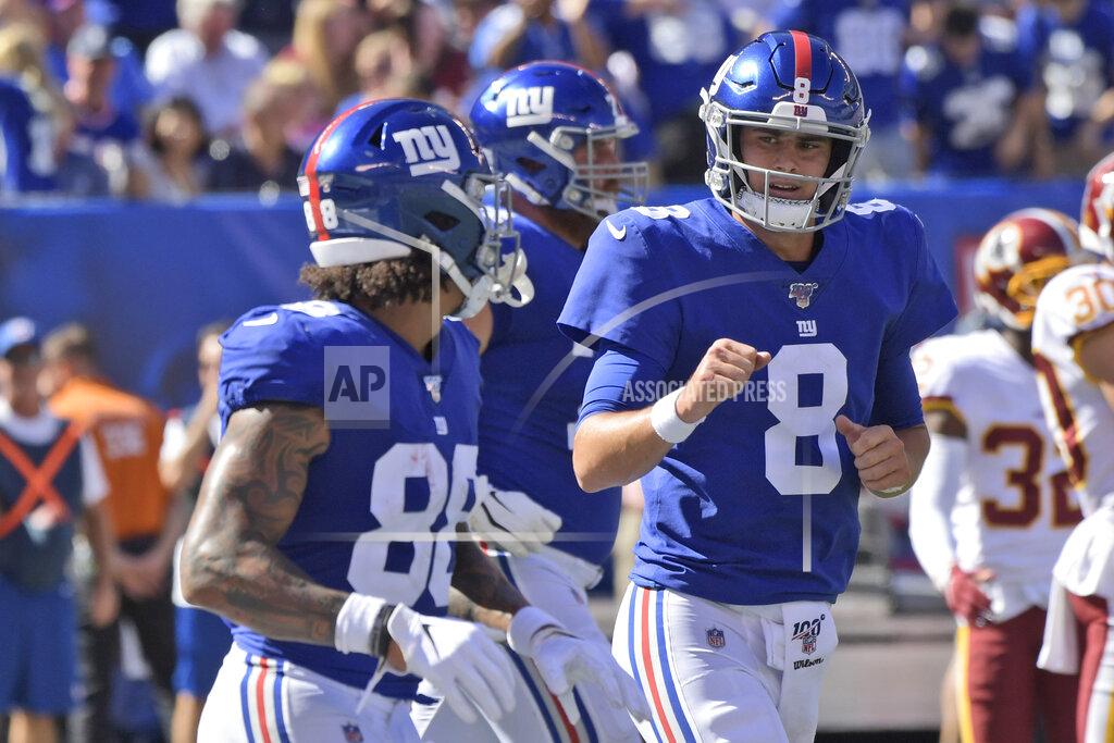 Bill Kostroun New York Giants quarterback Daniel Jones (8) reacts after teammate Wayne Gallman scored a touchdown during the first half of an NFL football game against the Washington Redskins, Sunday, Sept. 29, 2019, in East Rutherford, N.J. (AP Photo/Bill Kostroun)