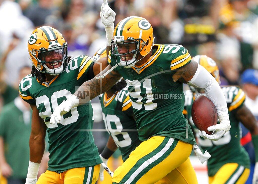 Matt Ludtke Green Bay Packers' Preston Smith celebrates after intercepting a pass during the first half of an NFL football game against the Minnesota Vikings Sunday, Sept. 15, 2019, in Green Bay, Wis. (AP Photo/Matt Ludtke)