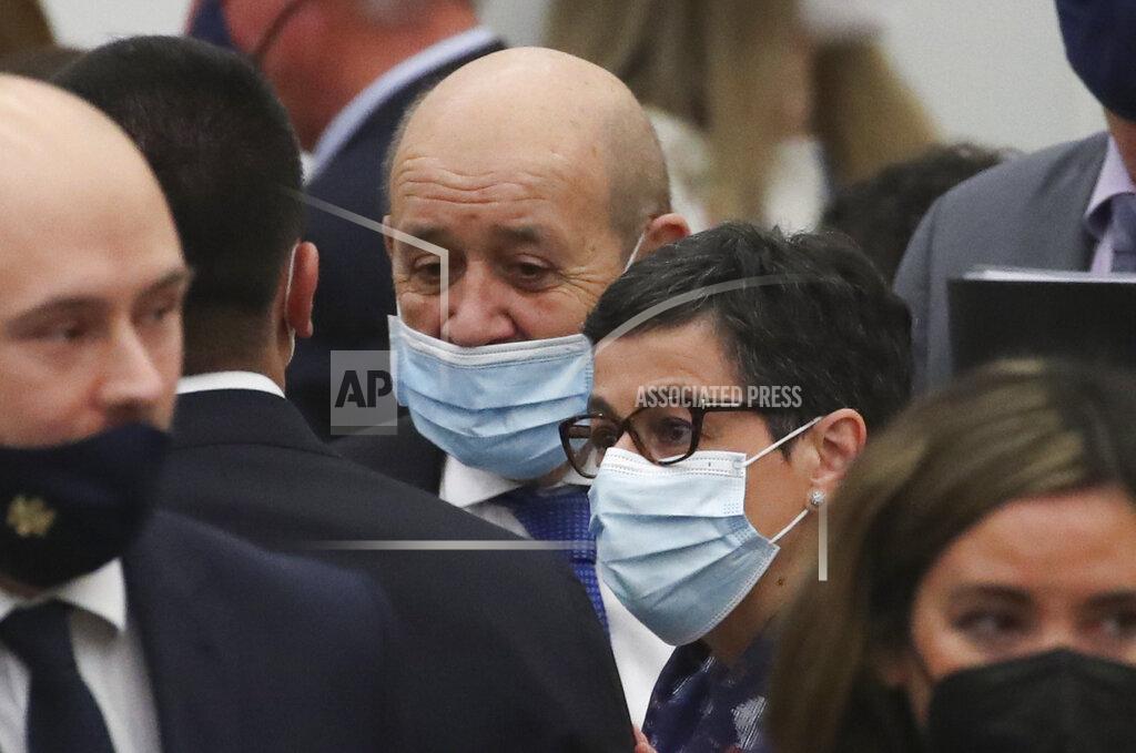 Yves Herman Spanish Foreign Minister Arancha Gonzalez Laya, right, and French Foreign Minister Jean-Yves Le Drian, center, talk to Italy's Foreign Minister Luigi Di Maio during a NATO foreign ministers meeting at NATO headquarters in Brussels, Tuesday, March 23, 2021. (Yves Herman, Pool via AP)
