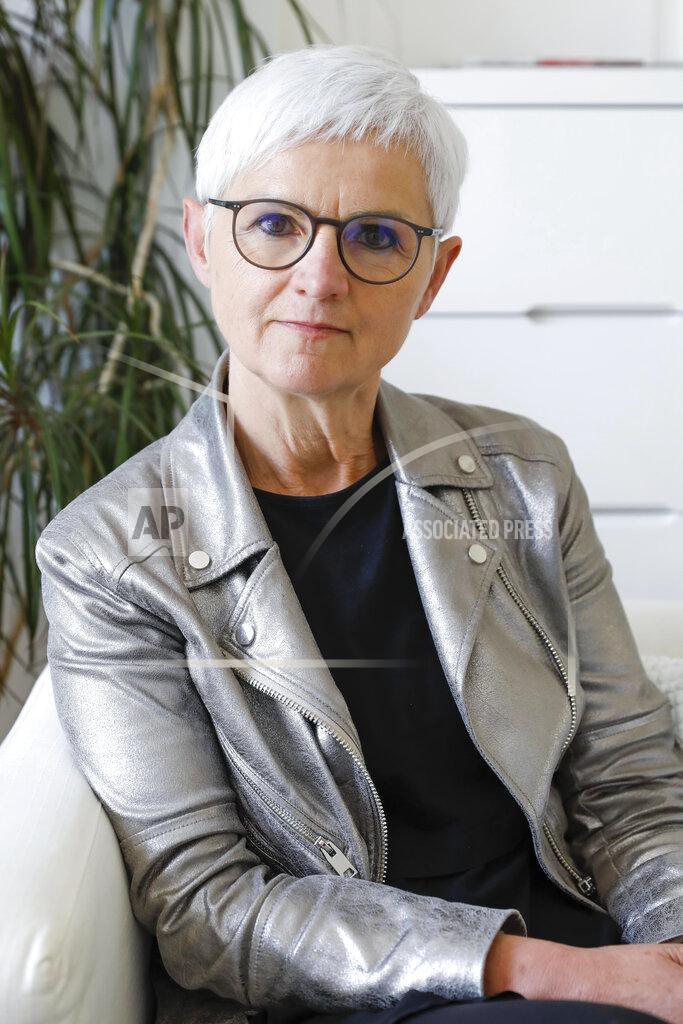 Lisa Leutner Maria Roesslhumer, who is the head of Austria's biggest network of women's shelters, poses for a portrait in Vienna, Austria, Thursday, May 20, 2021. Austria is one of the few European Union countries where the number of women killed is higher than the number of men. The recent high-profile cases have led to widespread protests, demands for government intervention and condemnations from top politicians. (AP Photo/Lisa Leutner)