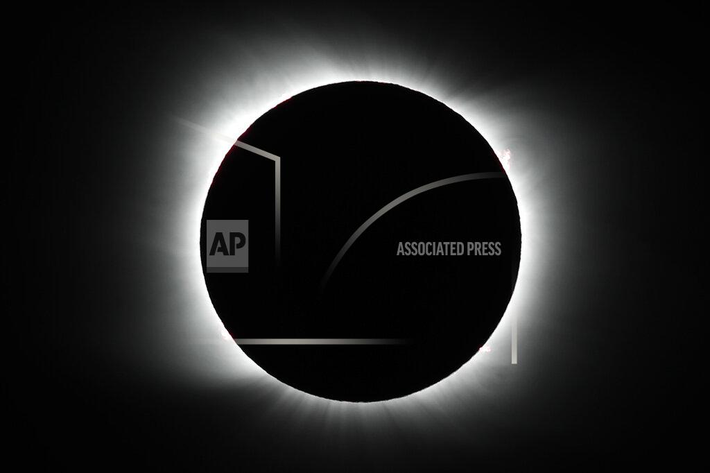 Natacha Pisarenko The moon covers the sun during a total solar eclipse in Piedra del Aguila, Argentina, Monday, Dec. 14, 2020. The total solar eclipse was visible from the northern Patagonia region of Argentina and from Araucania in Chile, and as a partial eclipse from the lower two-thirds of South America. (AP Photo/Natacha Pisarenko)