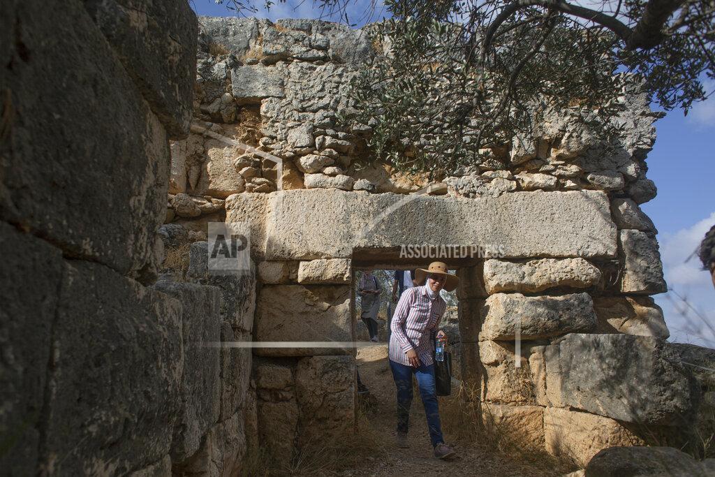 Nasser Nasser Hikers explore Deir Qalaa, "Monastery of the Castle," the remains of a Byzantine monastery near the Jewish settlement of Peduel and the Palestinian village of Deir Balout, west of the West Bank city of Salfit, Friday, June. 11, 2021. A growing number of Palestinians are taking up hiking, which offers a way to explore the countryside and historical landmarks in the Israeli-occupied West Bank. (AP Photo/Nasser Nasser)