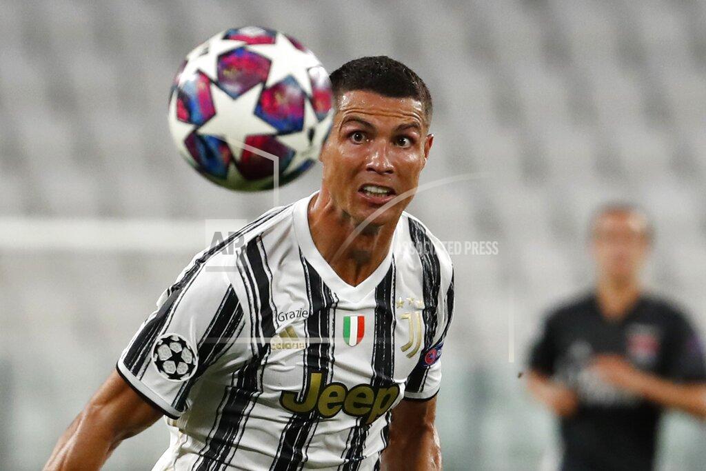 Antonio Calanni FILE - In this Aug. 7, 2020 file photo, Juventus' Cristiano Ronaldo eyes the ball during the Champions League round of 16 second leg, soccer match between Juventus and Lyon at the Allianz stadium in Turin, Italy. With the new Serie A season set to begin this weekend, the annual question arises: can anyone stop Juventus? (AP Photo/Antonio Calanni)