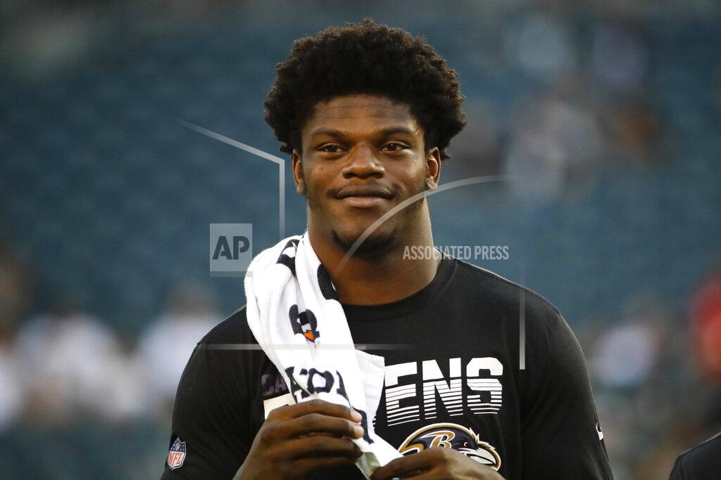 Matt Rourke FILE - In a Thursday, Aug. 22, 2019 file photo, Baltimore Ravens' Lamar Jackson before a preseason NFL football game against the Philadelphia Eagles, in Philadelphia. Jackson’s midseason promotion to starter for the Baltimore Ravens last year helped quarterbacks set an NFL record for carries and yards rushing in a season at their position. (AP Photo/Matt Rourke, File)