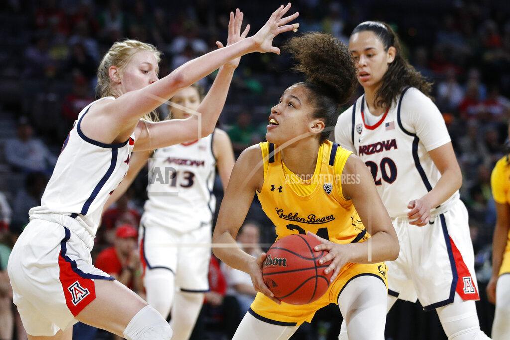 John Locher FILE - In this Friday, March 6, 2020, file photo, California's Evelien Lutje Schipholt (24) shoots against Arizona's Cate Reese, left, during the first half of an NCAA college basketball game in the quarterfinal round of the Pac-12 women's tournament in Las Vegas. The coronavirus pandemic has created problems greater than the inability to compete for the more than 20,000 foreign college athletes in the United States. Many are struggling with a decision about whether to stay in this country or return home. Schipholt, from The Netherlands, is staying with teammate Cailyn Crocker and her family in Southern California. (AP Photo/John Locher, File)