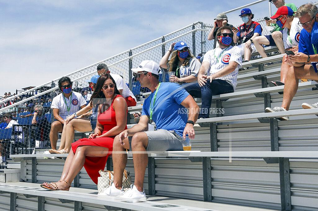 Teresa Crawford Fans on a rooftop overlooking Wrigley Field take In a baseball game between the Chicago Cubs and the Milwaukee Brewers, Saturday, July 25, 2020, in Chicago. (AP Photo/Teresa Crawford)