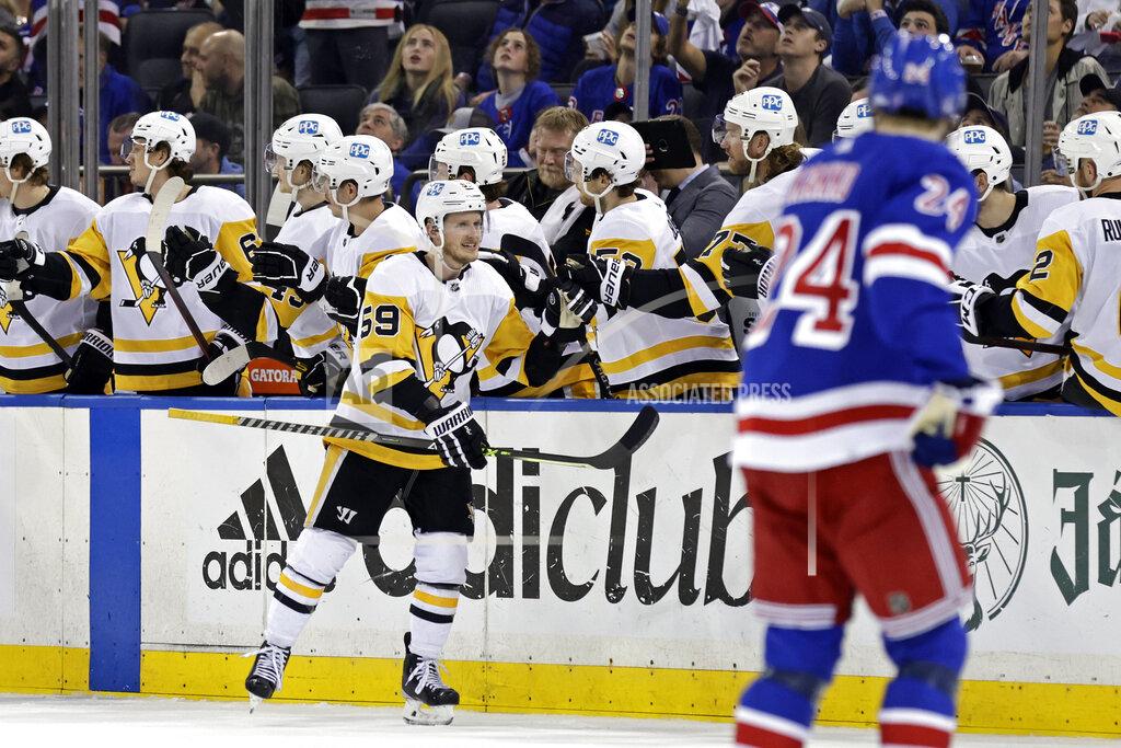 Adam Hunger Pittsburgh Penguins left wing Jake Guentzel (59) reacts with teammates after scoring a goal against the New York Rangers during the second period in Game 7 of an NHL hockey Stanley Cup first-round playoff series Sunday, May 15, 2022, in New York. (AP Photo/Adam Hunger)