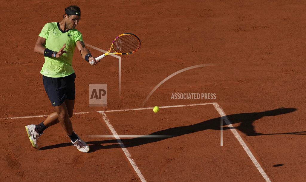 Christophe Ena Spain's Rafael Nadal plays a return to Australia's Alexei Popyrin during their first round match on day three of the French Open tennis tournament at Roland Garros in Paris, France, Tuesday, June 1, 2021. (AP Photo/Christophe Ena)