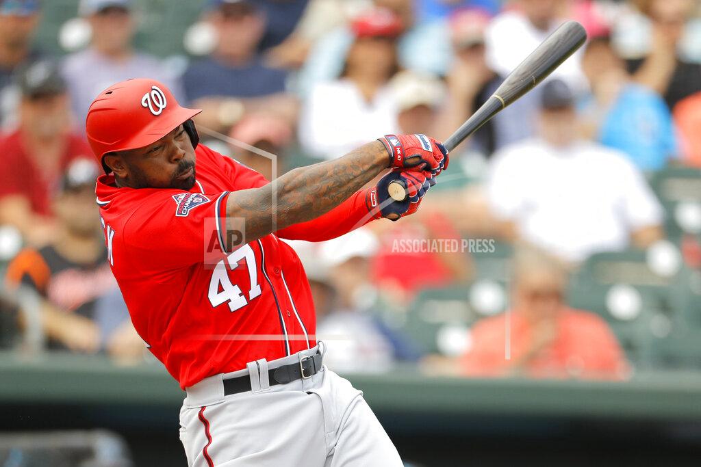 Julio Cortez FILE - In this March 10, 2020, file photo, Washington Nationals designated hitter Howie Kendrick swings at a pitch from Miami Marlins' Caleb Smith during the second inning of a spring training baseball game in Jupiter, Fla. Designated hitters will be used in National League games this season. (AP Photo/Julio Cortez, File)