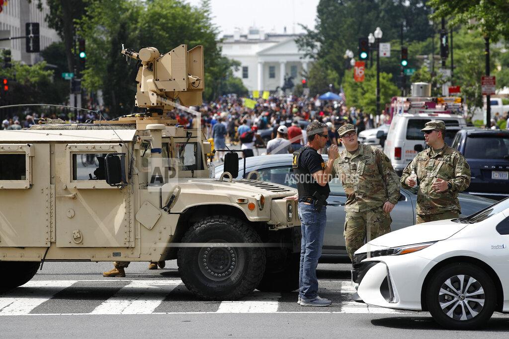 Patrick Semansky A checkpoint blocks traffic on 16th Street Northwest as people gather near the White House, Saturday, June 6, 2020, in Washington, before scheduled protests over the death of George Floyd, who died after being restrained by Minneapolis police officers. (AP Photo/Patrick Semansky)