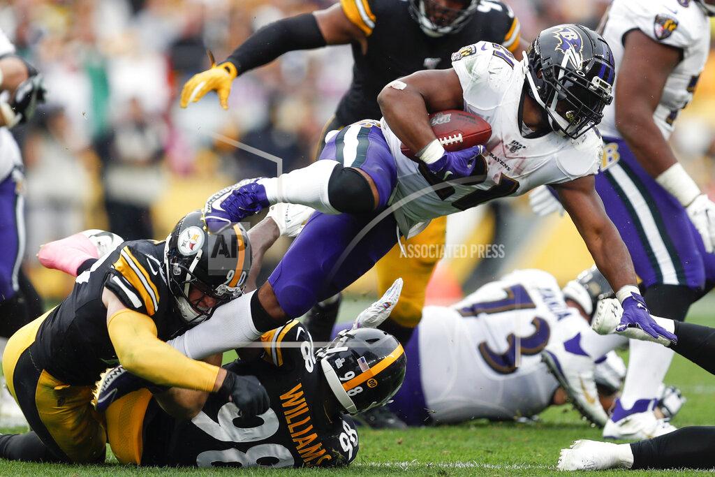 Don Wright Baltimore Ravens running back Mark Ingram (21) leaps over Pittsburgh Steelers outside linebacker T.J. Watt (90) on a run in the second half of an NFL football game, Sunday, Oct. 6, 2019, in Pittsburgh. (AP Photo/Don Wright)