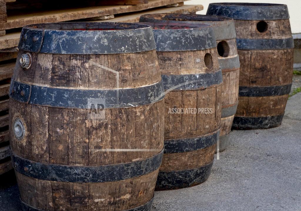Michael Probst In this , Friday, April 17, 2020 phot old beer barrels of the "Wernecker brewery" are seen at the brewery in Werneck, Germany. Due to the impact of the coronavirus the traditional brewery has to close 400 years after its foundation. (AP Photo/Michael Probst)