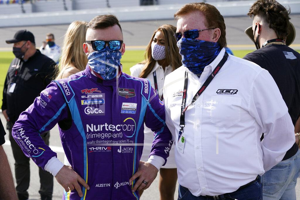 John Raoux Austin Dillon, left, talks with his grandfather Richard Childress on pit road before the start of the Rolex 24 hour auto race at Daytona International Speedway, Saturday, Jan. 30, 2021, in Daytona Beach, Fla. (AP Photo/John Raoux)