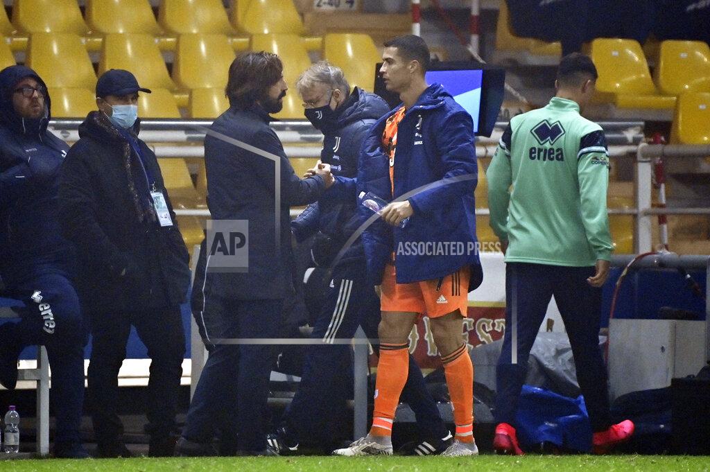 Massimo Paolone Juventus' head coach Andrea Pirlo, third left, and Juventus' Cristiano Ronaldo, second right, shake hands at the Italian Serie A soccer match between Parma and Juventus at the Ennio Tardini stadium in Parma, Italy, Saturday, Dec. 19, 2020. (Massimo Paolone/LaPresse via AP)
