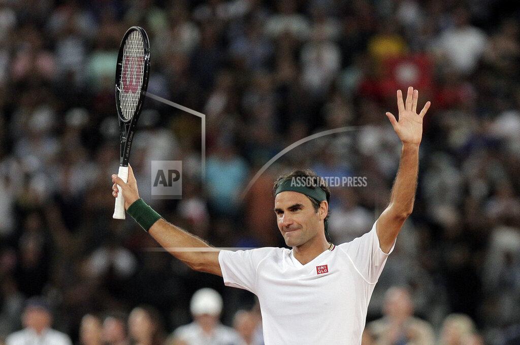 Halden Krog FILE - In this file photo dated Friday Feb. 7, 2020, Roger Federer thanks the crowd after winning 3 sets to 2 against Rafael Nadal in their exhibition tennis match held at the Cape Town Stadium in Cape Town, South Africa. The 20-time Grand Slam champion Roger Federer will face the winner of the match between Jeremy Chardy and Dan Evans in the Qatar Open next week in his first competition for more than a year. (AP Photo/Halden Krog, FILE)