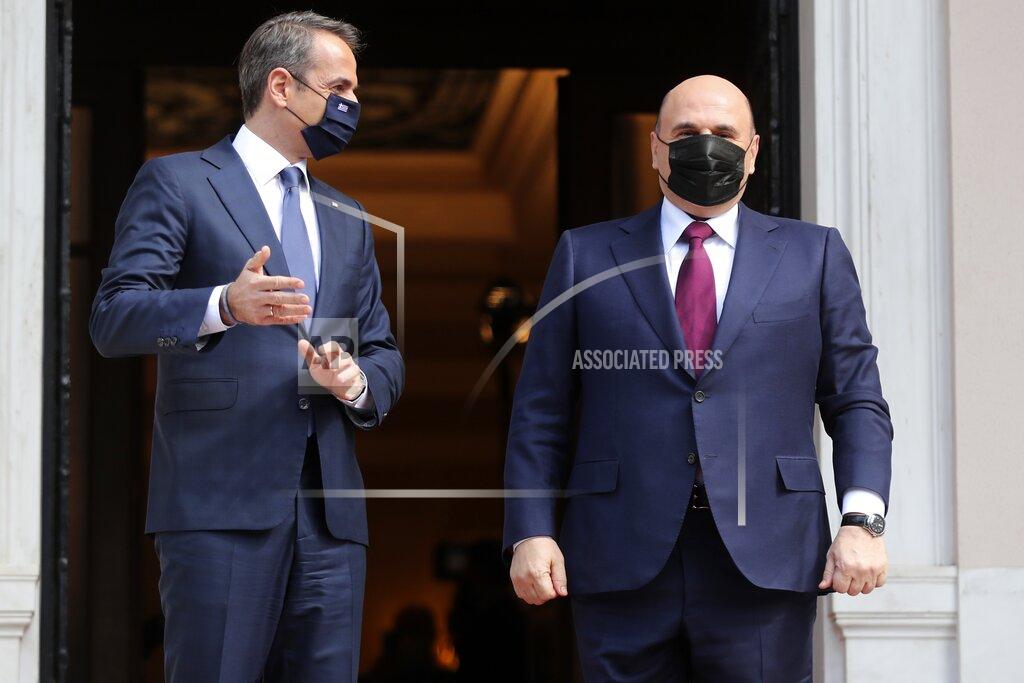 Petros Giannakouris Greece's Prime Minister Kyriakos Mitsotakis, left, welcomes Russian Prime Minister Mikhail Mishustin at Maximos Mansion in Athens, Wednesday, March 24, 2021. Greece is kicking off two days of celebrations to mark the bicentenary of the start of the country's war of independence, although events are far more muted than originally planned due to the coronavirus pandemic. (AP Photo/Petros Giannakouris)