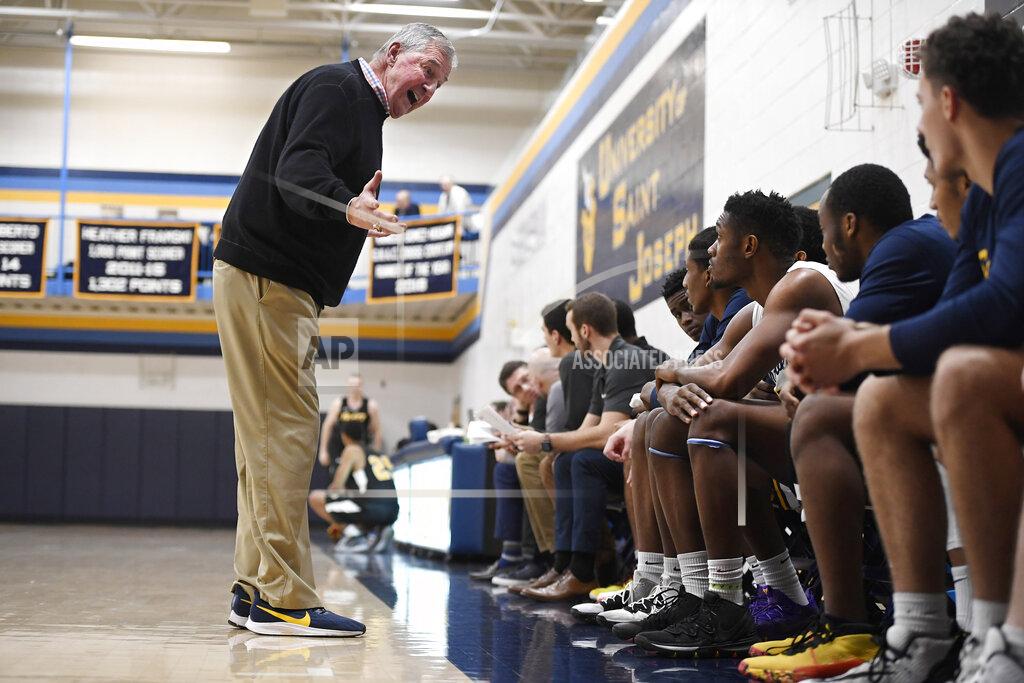 Jessica Hill Saint Joseph coach Jim Calhoun talks to his team during the first half of an NCAA college basketball game against Pratt Institute, Friday, Jan. 10, 2020, in West Hartford, Conn. Now coaching Division III basketball with the same fire he stalked the sidelines at UConn, Calhoun is reaching his 900th win as a college coach. (AP Photo/Jessica Hill)