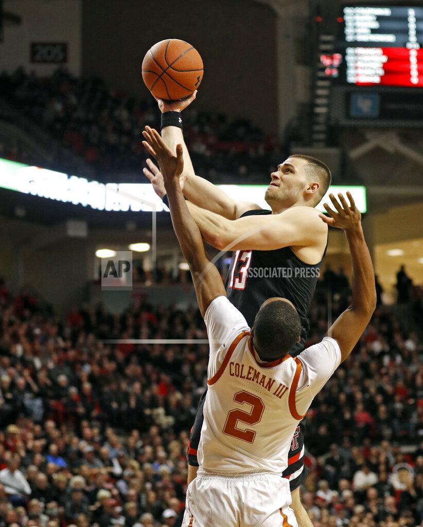 Brad Tollefson Texas Tech's Matt Mooney (13) shoots over Texas' Matt Coleman III (2) during the first half of an NCAA college basketball game Monday, March 4, 2019, in Lubbock, Texas. (AP Photo/Brad Tollefson)