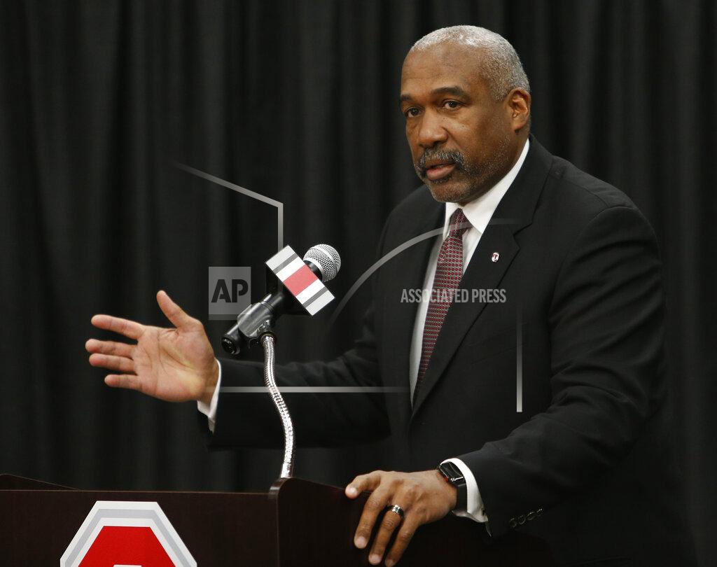 Ohio State athletics director Gene Smith answers questions during a news conference, Tuesday, Dec. 4, 2018, in Columbus, Ohio. Ohio State's athletic department will cut 25 jobs, furlough hundreds of other employees and ask coaches and others to take 5% pay cuts to help grapple with a projected $107 million budget deficit due to the COVID-19 pandemic, athletic director Gene Smith said Wednesday, Sept. 23, 2020. (AP Photo/Jay LaPrete)