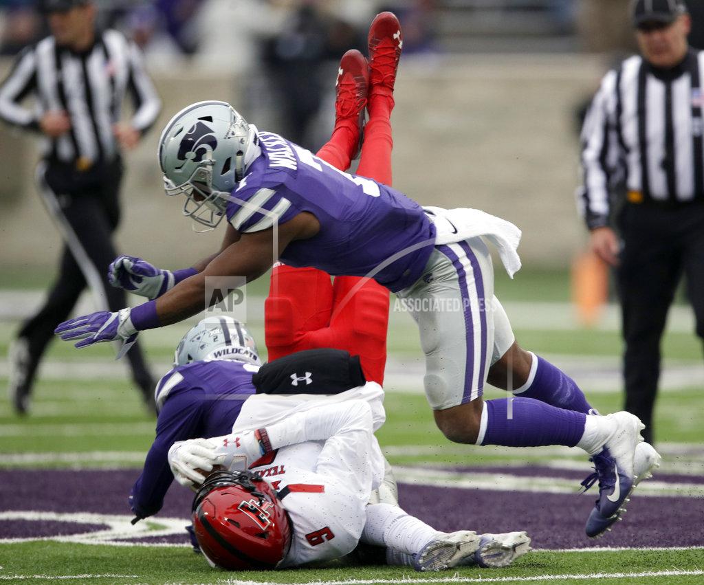 Orlin Wagner Kansas State defensive back Eli Walker (7) knocks down Texas Tech wide receiver T.J. Vasher (9) during the first half of an NCAA college football game in Manhattan, Kan., Saturday, Nov. 17, 2018. (AP Photo/Orlin Wagner)