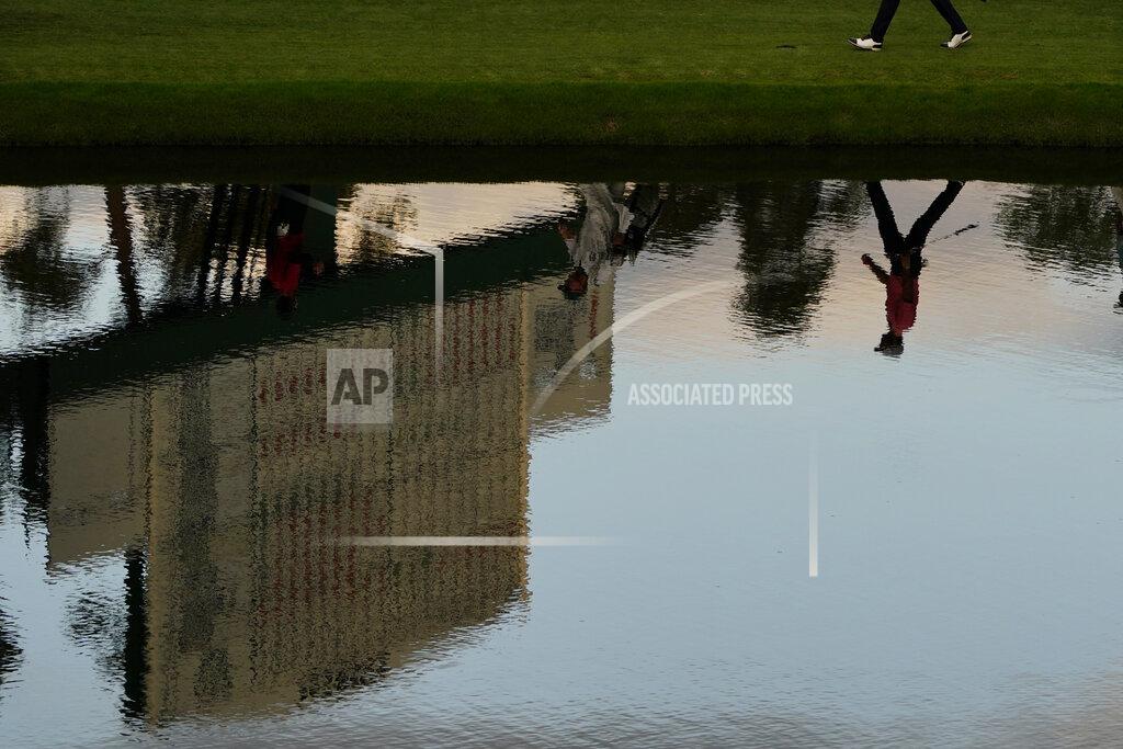 Matt Slocum Dylan Frittelli, of South Africa, is reflected in the water has he walks along the 16th fairway during the first round of the Masters golf tournament Thursday, Nov. 12, 2020, in Augusta, Ga. (AP Photo/Matt Slocum)