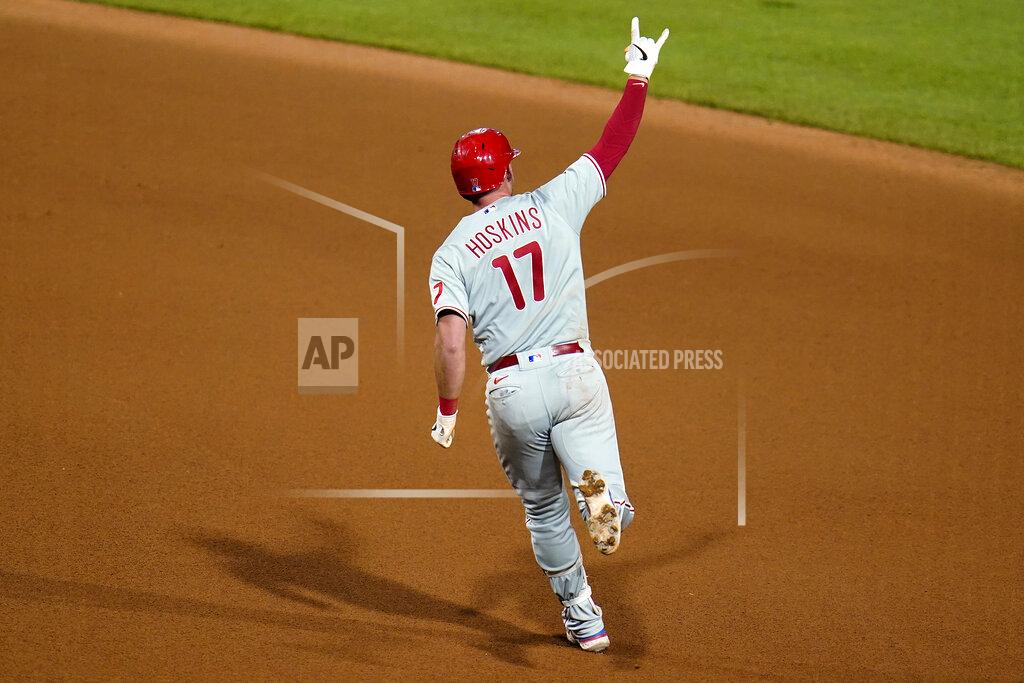 Gene J. Puskar Philadelphia Phillies' Rhys Hoskins celebrates as he runs the bases on a two-run home run off Pittsburgh Pirates relief pitcher Duane Underwood Jr. during the 10th inning of a baseball game in Pittsburgh, Friday, July 29, 2022. The Phillies won 4-2. (AP Photo/Gene J. Puskar)
