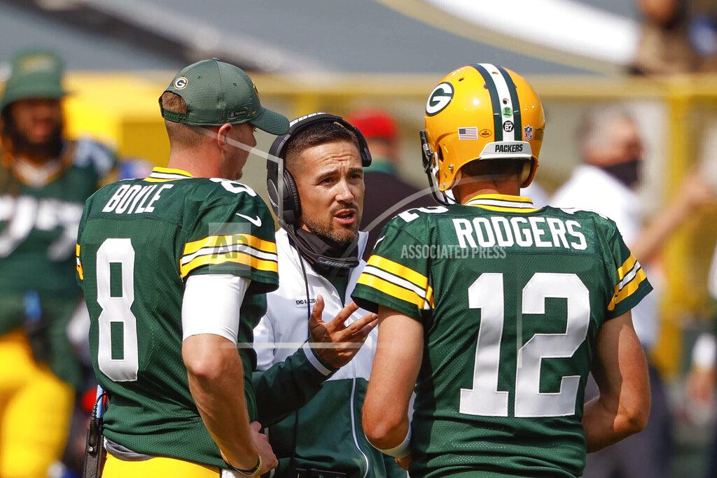 Jeffrey Phelps FILE - In this Sept. 20, 2020, file photo, Green Bay Packers coach Matt LaFleur speaks to quarterbacks Aaron Rodgers (12) and Tim Boyle (8) during a timeout in the team's NFL football game against the Detroit Lions in Green Bay, Wis. All the concerns about how well LaFleur would work with veteran quarterback Rodgers have disappeared near the end of their second season together. LaFleur, who came to Green Bay after one unremarkable season as the Tennessee Titans’ offensive coordinator, has teamed with Rodgers to make Green Bay one of the NFL’s most dynamic offenses. (AP Photo/Jeffrey Phelps, File)